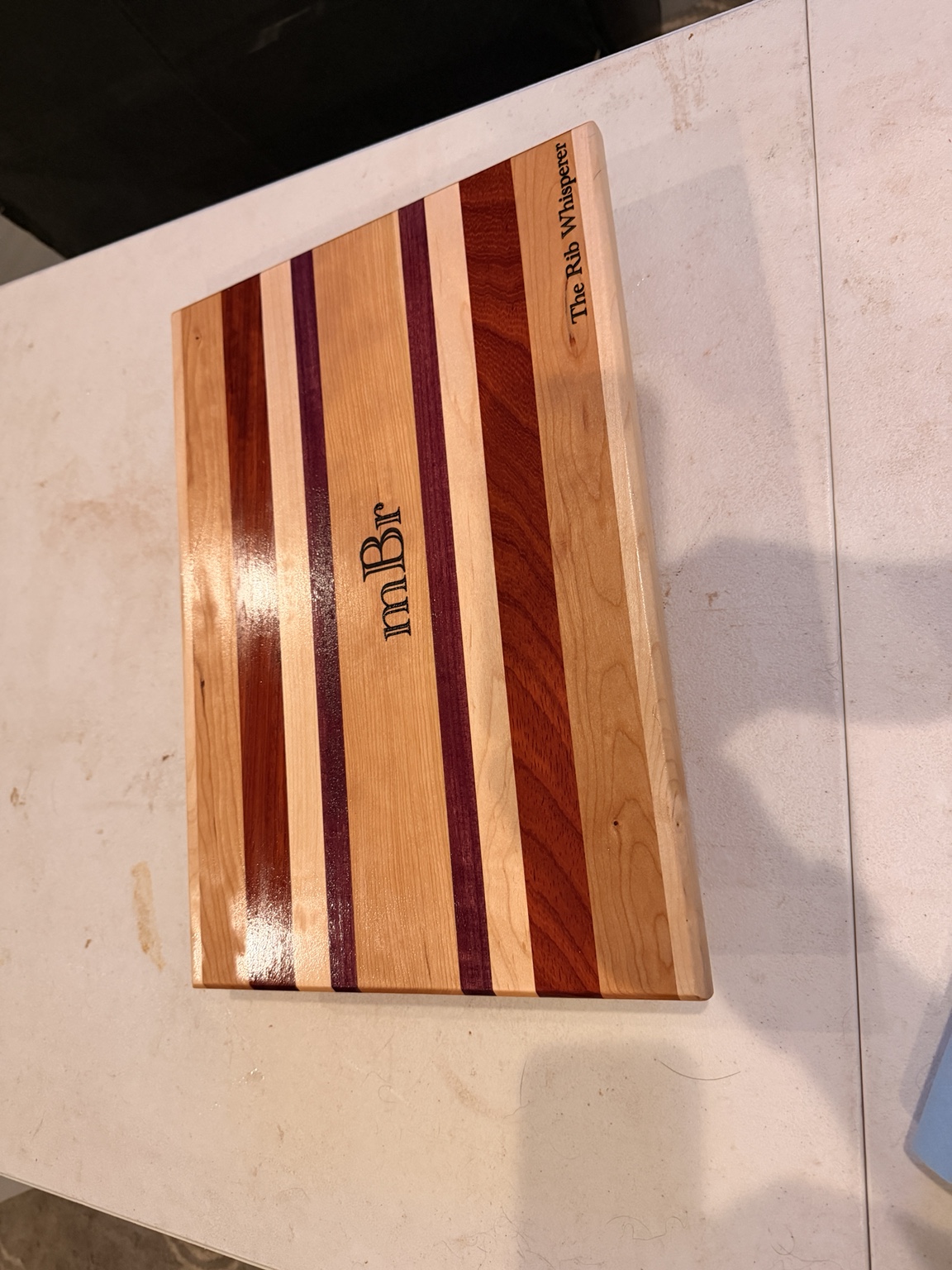 Engraved cutting board with The Rib Whisperer text