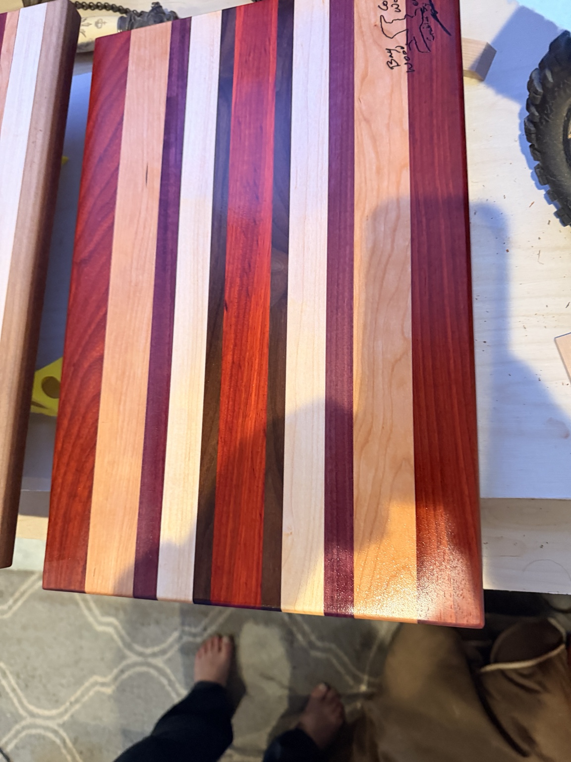 Gloss-finished striped hardwood cutting board